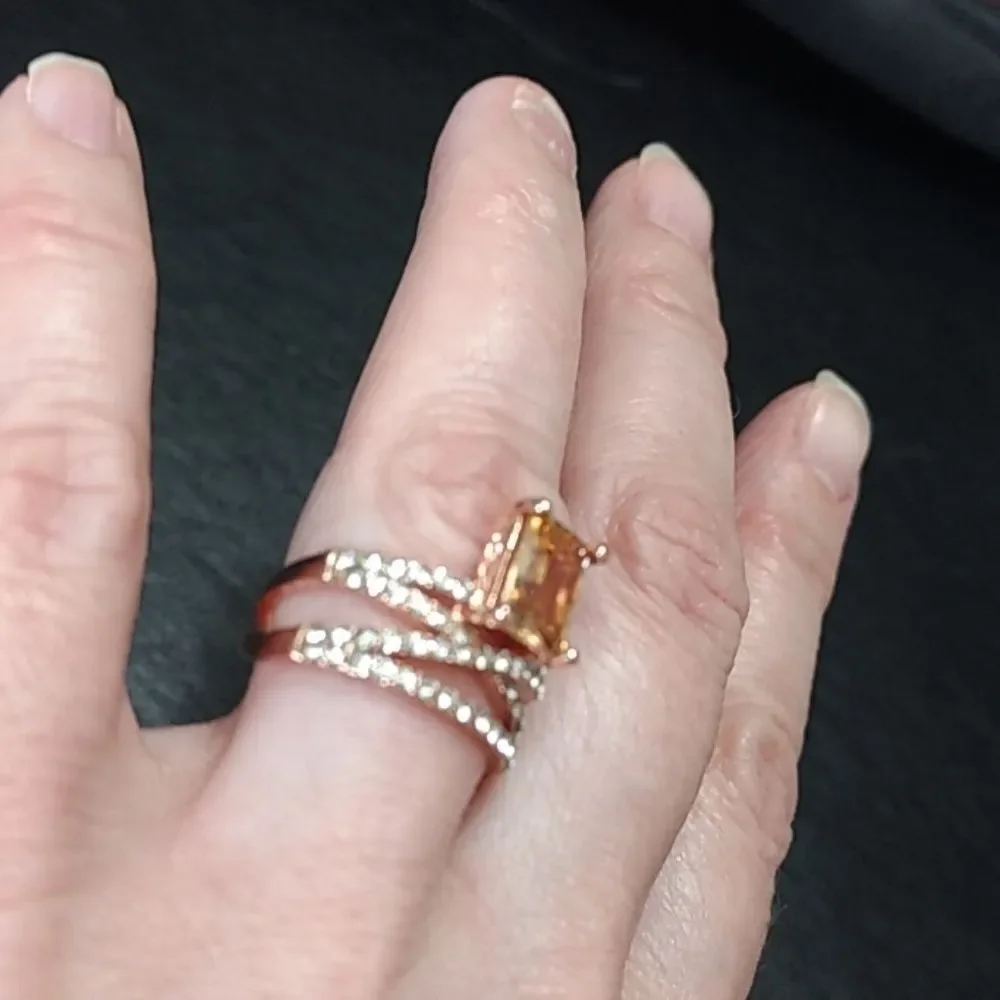 Rose gold colored ring with champagne stone Size 6